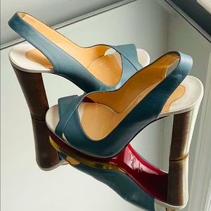 Christian Louboutin open toe sling back pump.